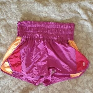 Vibrant Pink and Orange Athletic Shorts with Moisture-Wicking Fabric